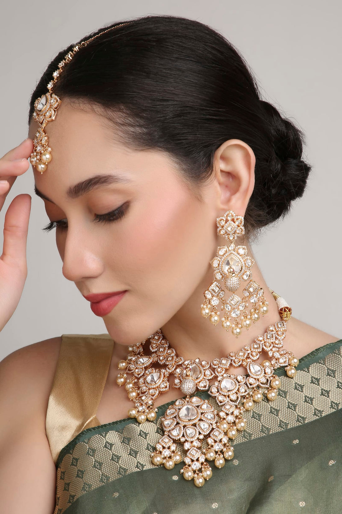 A model wearing a Sirini necklace set, styled as a gift